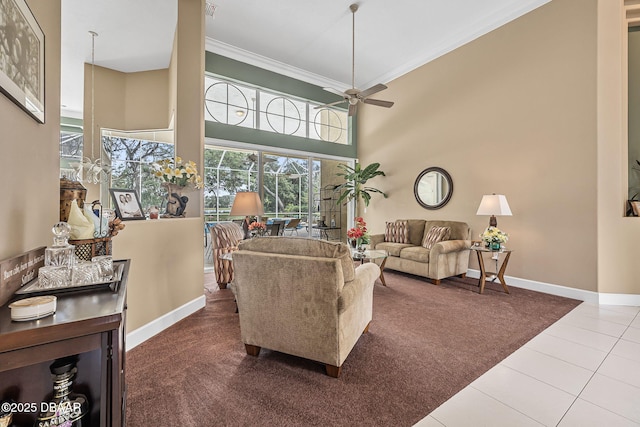 1766 Roscoe Turner Trl, Port Orange, FL 32128 - carpeted living room with ornamental molding, baseboards, a ceiling fan, a towering ceiling, and tile patterned flooring