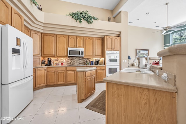 1766 Roscoe Turner Trl, Port Orange, FL 32128 - kitchen featuring white appliances, a sink, backsplash, ceiling fan, and light countertops