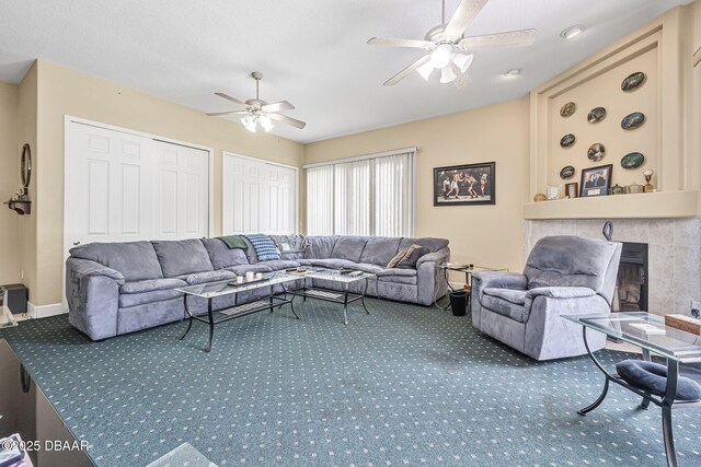 1766 Roscoe Turner Trl, Port Orange, FL 32128 - carpeted living room featuring ceiling fan and a tiled fireplace