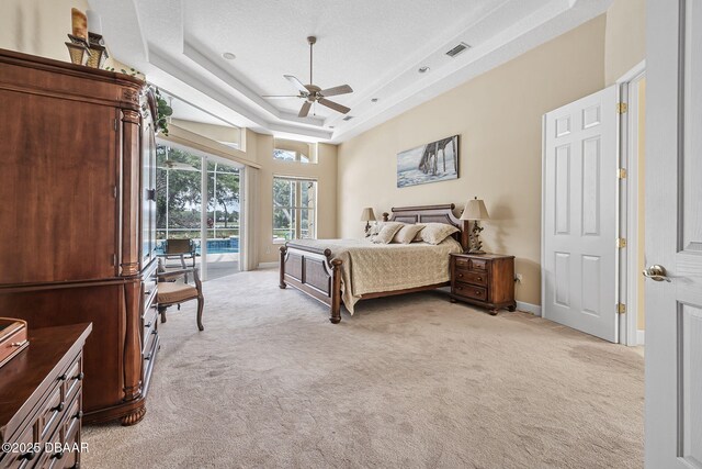 1766 Roscoe Turner Trl, Port Orange, FL 32128 - bedroom featuring light colored carpet, access to outside, a tray ceiling, baseboards, and ceiling fan