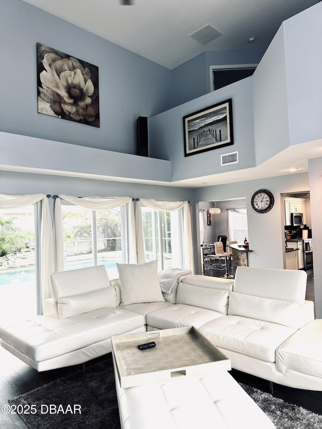 living room with a towering ceiling