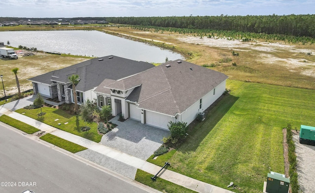 birds eye view of property with a water view