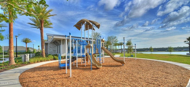 view of jungle gym with a water view