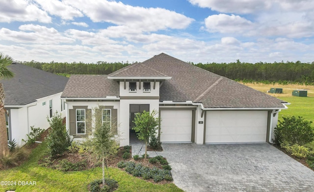 view of front of property with a garage