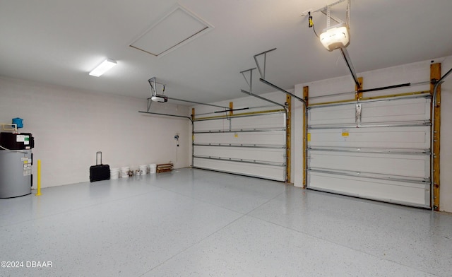 garage featuring electric water heater and a garage door opener