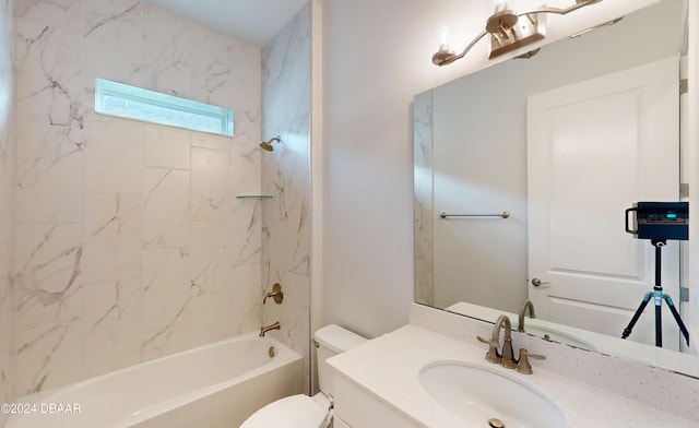 full bathroom with vanity, toilet, and tiled shower / bath