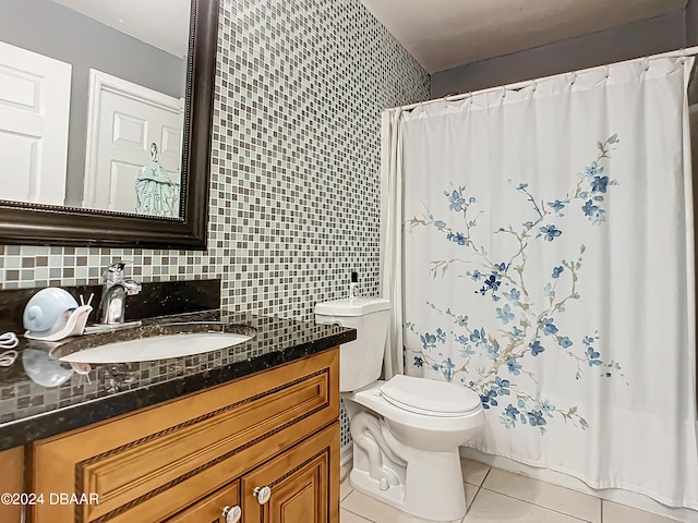 bathroom with toilet, decorative backsplash, vanity, and tile patterned floors