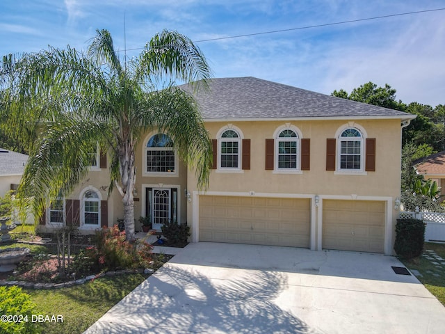 view of front of property with a garage