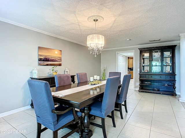 dining space featuring a textured ceiling, light tile patterned floors, and crown molding