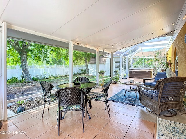 sunroom / solarium featuring track lighting