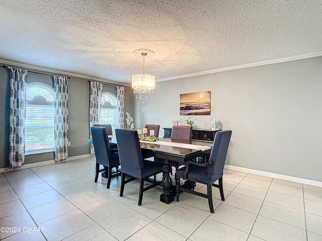 dining space with ornamental molding, a textured ceiling, a chandelier, and light tile patterned floors