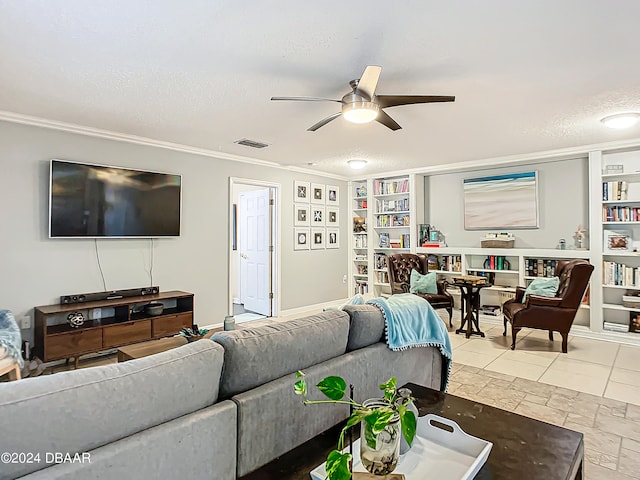 living room with ceiling fan, a textured ceiling, tile patterned flooring, and ornamental molding