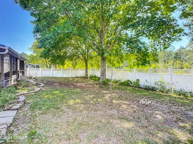 view of yard with a sunroom