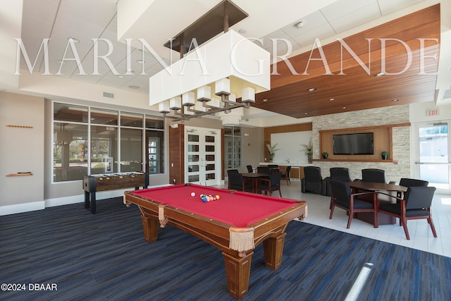 recreation room with a high ceiling and pool table