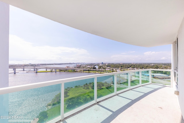 balcony featuring a water view