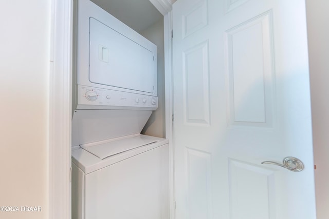 laundry area featuring stacked washer and dryer