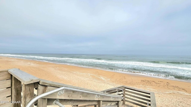 property view of water featuring a beach view