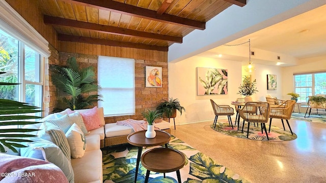 living room featuring beamed ceiling and wooden ceiling