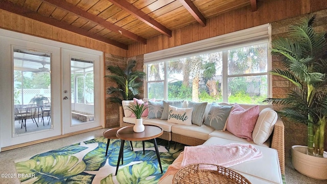 sunroom with beam ceiling, wood ceiling, and french doors