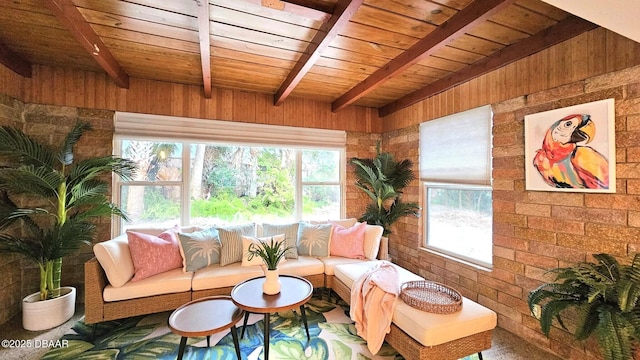 living room featuring beam ceiling, wooden walls, wooden ceiling, and brick wall