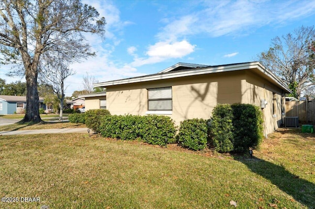 view of home's exterior with a yard