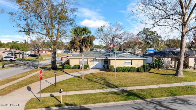 ranch-style house with a front yard