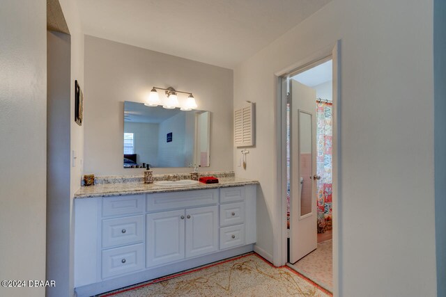 bathroom featuring vanity and shower / tub combo