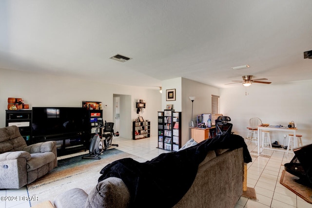 tiled living room with ceiling fan