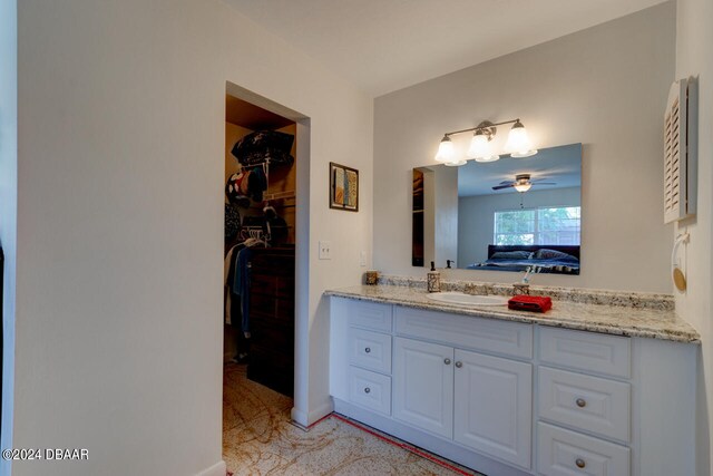 bathroom with vanity and ceiling fan