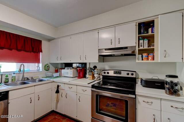 kitchen with stainless steel appliances, white cabinets, and sink