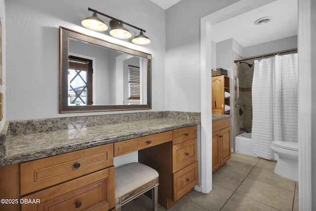 full bathroom featuring tile patterned flooring, vanity, toilet, and shower / bath combo