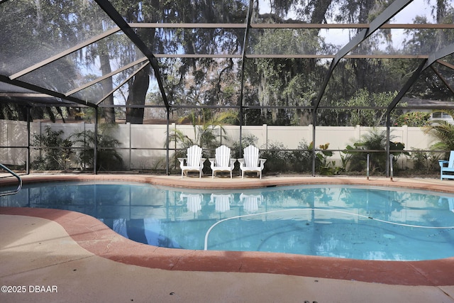 view of pool with a lanai