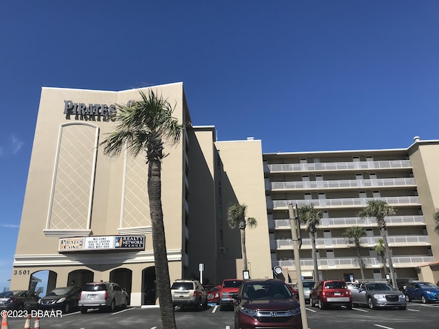 3501 S Atlantic Ave Unit 2050, Daytona Beach, FL 32118 - view of apartment building / complex featuring uncovered parking