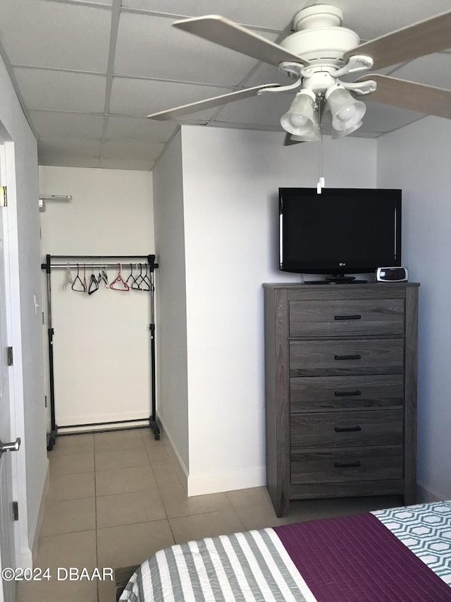 3501 S Atlantic Ave Unit 2050, Daytona Beach, FL 32118 - bedroom featuring tile patterned flooring, ceiling fan, and a drop ceiling