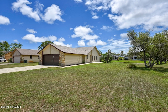 view of front of house with a garage and a front yard