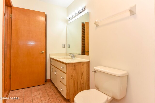 bathroom with toilet and vanity