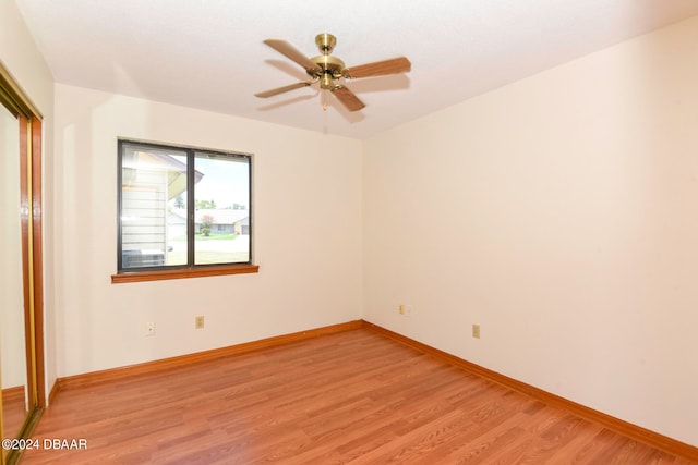 unfurnished room featuring light hardwood / wood-style floors and ceiling fan