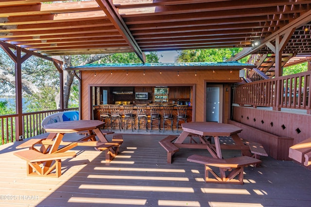 wooden terrace featuring outdoor dry bar