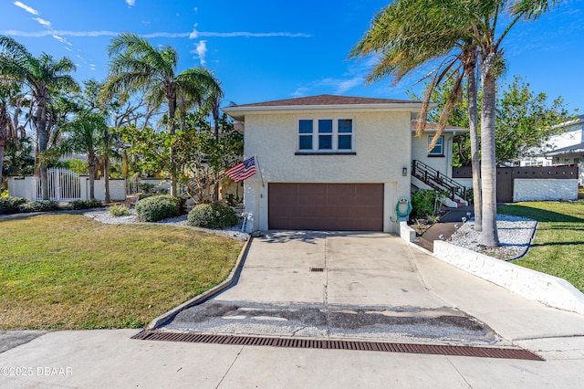 view of front of home featuring stucco siding, a front lawn, concrete driveway, a garage, and stairs