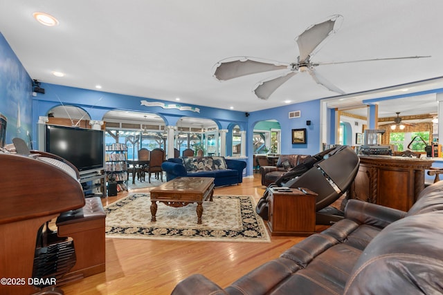 living room featuring recessed lighting, visible vents, wood finished floors, and ceiling fan