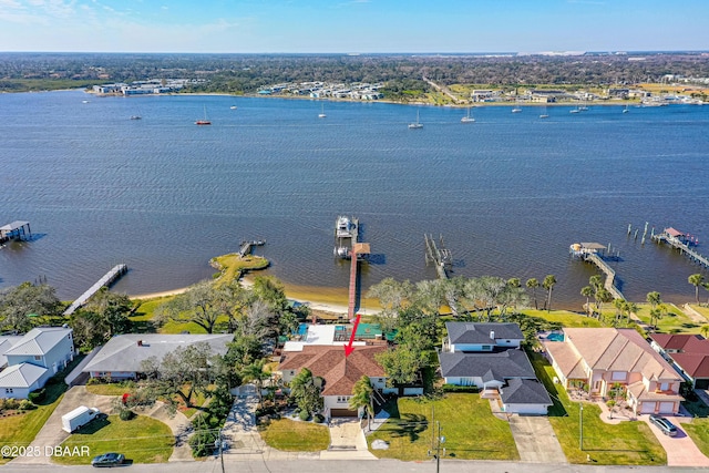 birds eye view of property featuring a water view