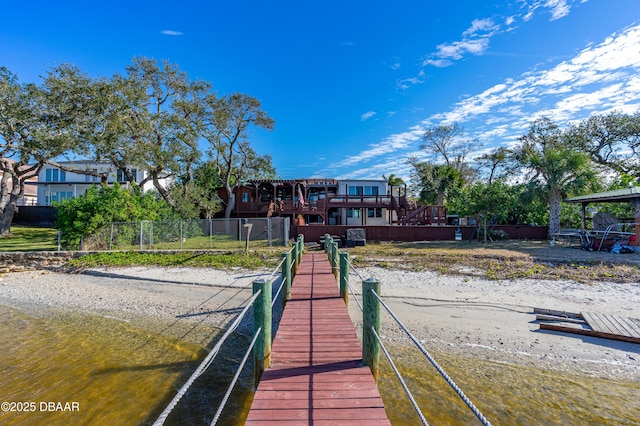 dock area featuring a wooden deck and fence