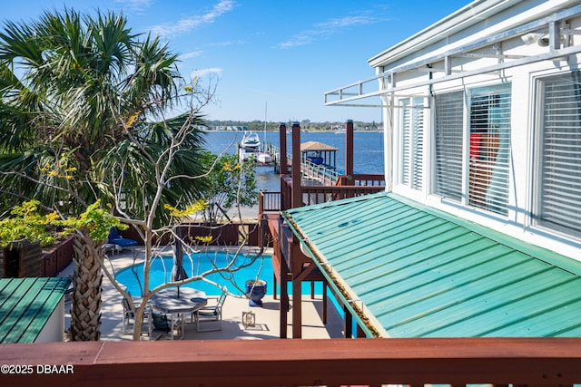 view of swimming pool with a water view