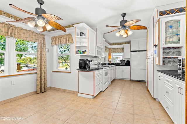 kitchen with open shelves, dark countertops, white cabinetry, white appliances, and light tile patterned floors