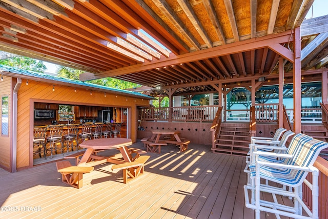 deck featuring exterior bar