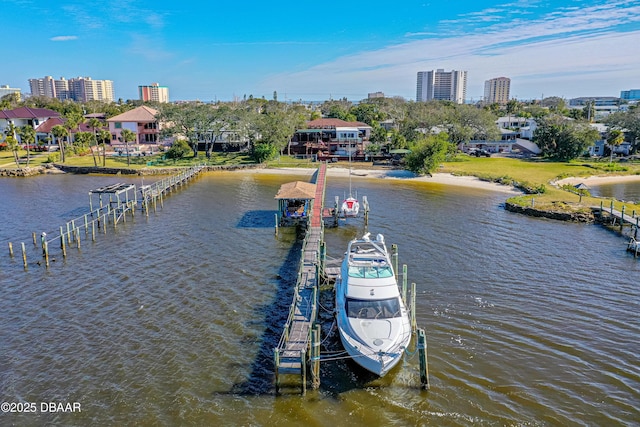 view of dock featuring a view of city and a water view