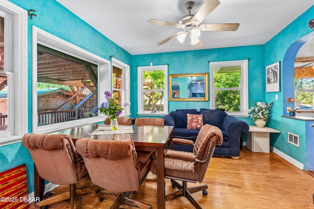 dining space featuring ceiling fan and light hardwood / wood-style flooring