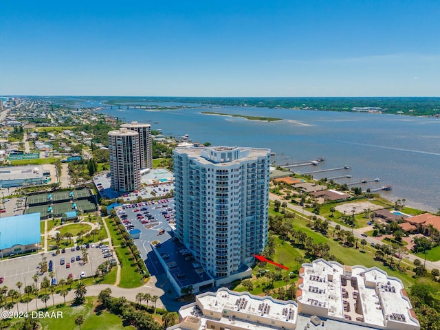 birds eye view of property with a water view