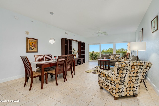 tiled dining space with ceiling fan