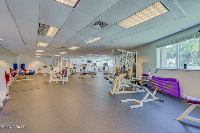 exercise room featuring a drop ceiling